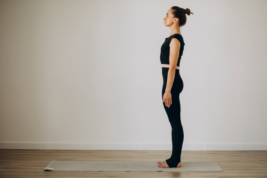Young lady on yoga mat