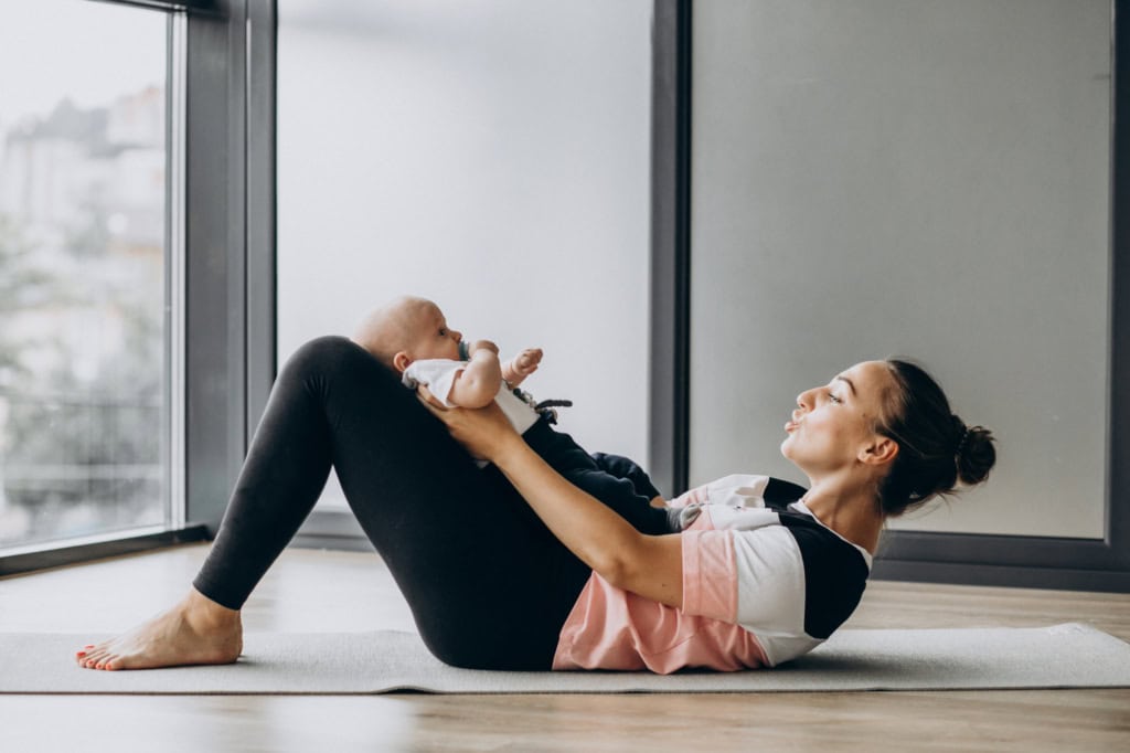 Women laying back with her baby