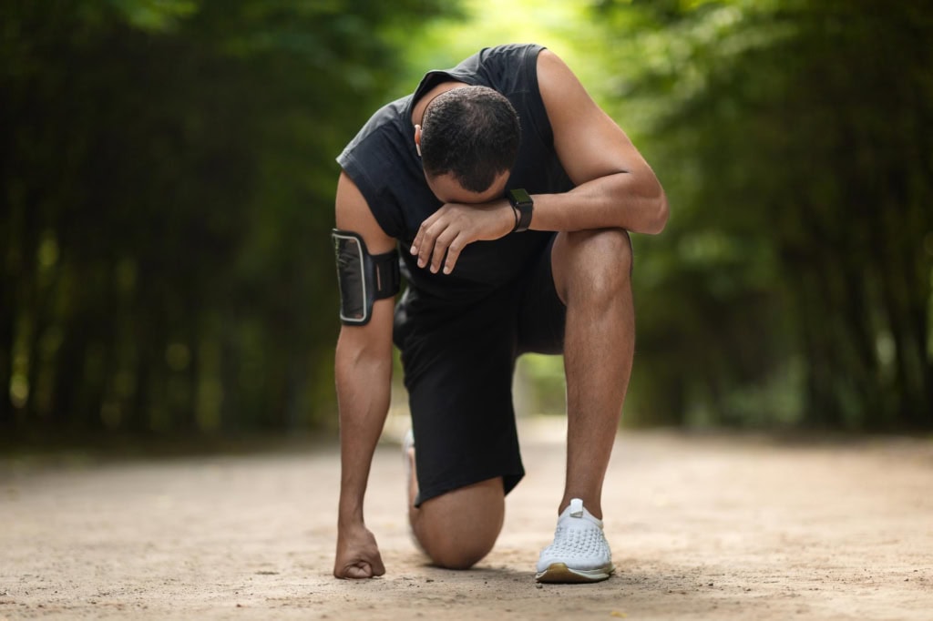 Man running and having a rest