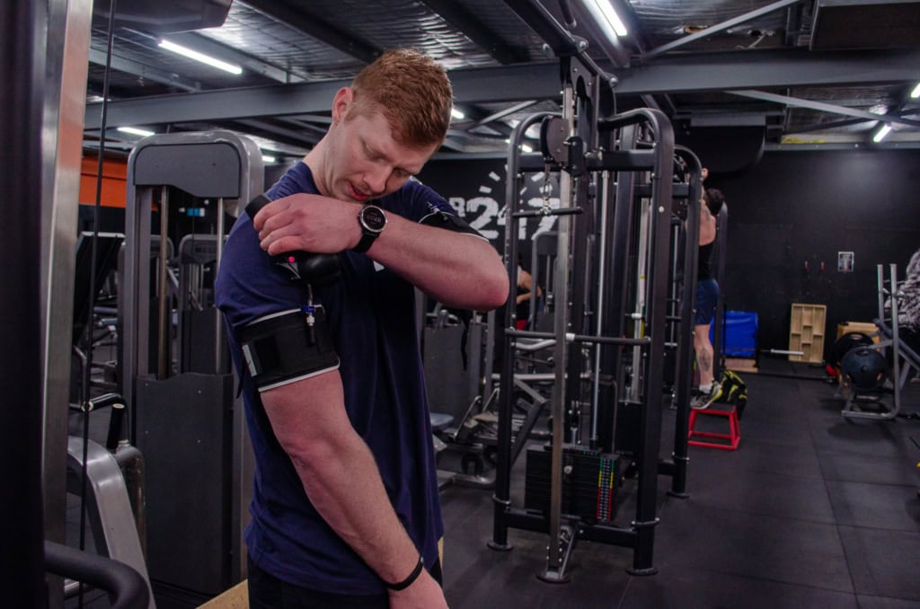 Athlete doing blood flow restriction training in the gym